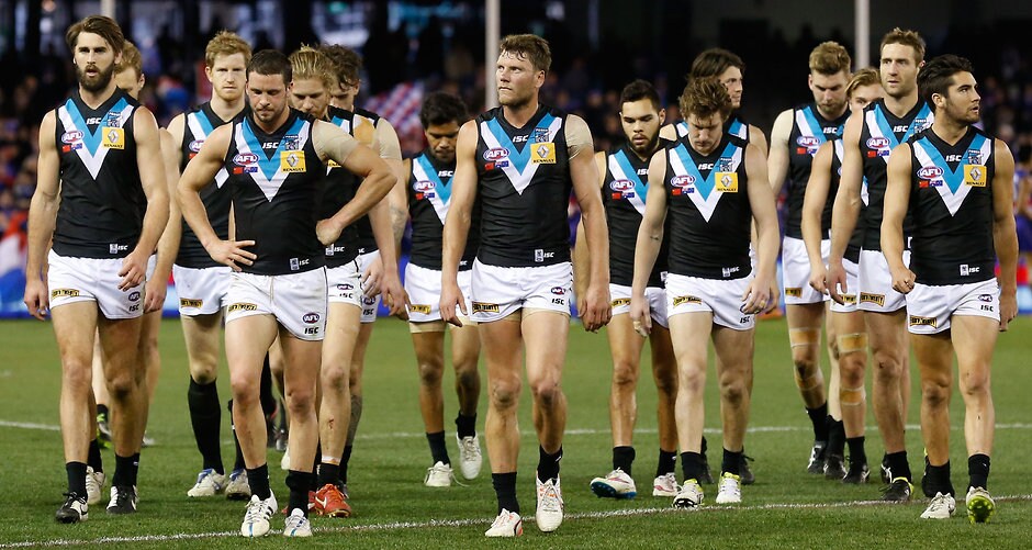 AFL 2015 Rd 19 - Western Bulldogs v Port Adelaide MELBOURNE, AUSTRALIA - AUGUST 8: The Power look dejected after a loss during the 2015 AFL round 19 match between the Western Bulldogs and Port Adelaide Power at Etihad Stadium, Melbourne, Australia on August 8, 2015. (Photo by Michael Willson/AFL Media)